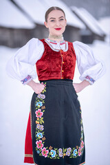 Young beautiful slovak woman in traditional costume. Slovak folklore