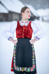 Young beautiful slovak woman in traditional costume. Slovak folklore