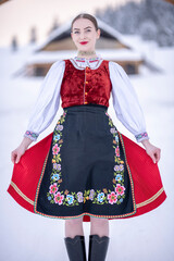 Young beautiful slovak woman in traditional costume. Slovak folklore
