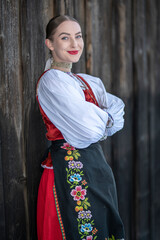 Young beautiful slovak woman in traditional costume. Slovak folklore