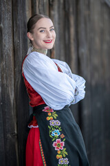 Young beautiful slovak woman in traditional costume. Slovak folklore
