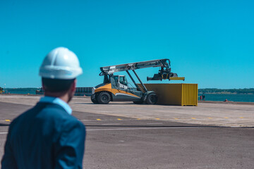 Engineer controlling container logistics work at the port, businessman at the port. containers for exporting