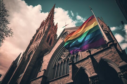 Lgbt rainbow pride flag in front of the Catholic church.