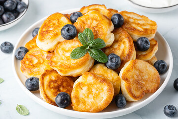Homemade mini pancakes with blueberries