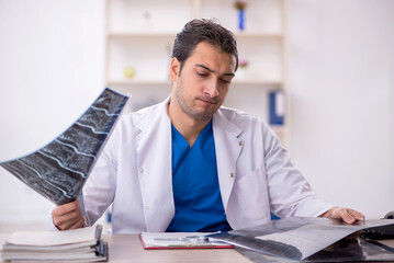 Fototapeta premium Young male doctor radiologist working in the clinic