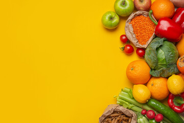 bright vegetables and fruits on a yellow background