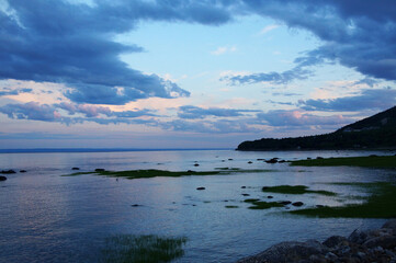 Beautiful coastal sunset with heron - 574786507