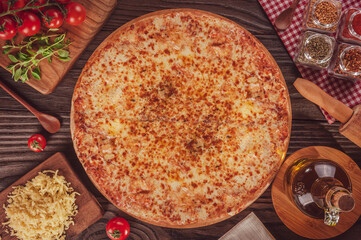 Pizza with three kind of cheeses, mozzarela, parmesan and provolone (Três queijos) - Top view.