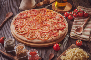 Brazilian pizza with mozzarella, tomato and oregano (Pizza de mussarela) - Isolated.