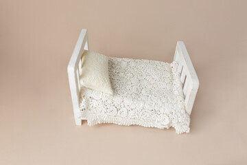 bed for children's photo shoots. background texture for newborn photo. white wooden bed