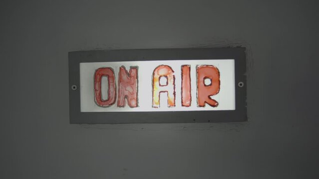 The 'ON AIR' Sign in a Radio Studio Illuminated