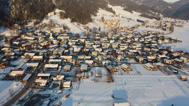Aerial view of Reit im Winkel full of snow during sunset in the winter