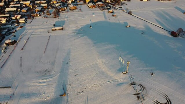 Aerial view of Reit im Winkel full of snow during sunset in the winter