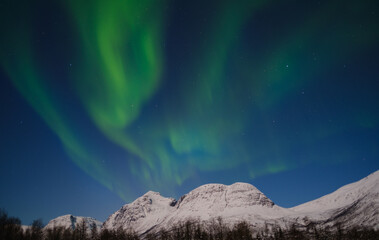 Northern Lights On Snowy Mountain