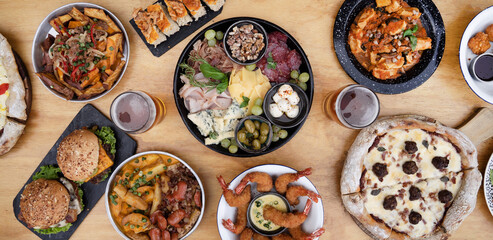 Banquet. Panorama view of the restaurante table with a large variety of dishes and flavors. 