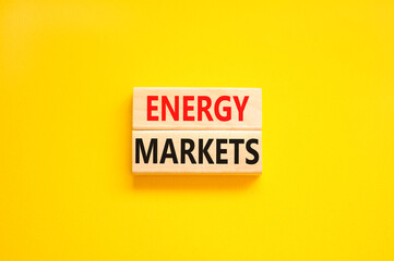 Energy markets symbol. Concept words Energy markets on wooden block. Beautiful yellow table yellow background. Business energy markets concept. Copy space.