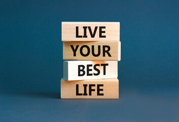 Live your best life symbol. Concept words Live your best life on wooden blocks. Beautiful grey table grey background. Business live your best life concept. Copy space.