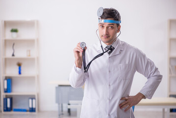 Young male doctor otolaryngologist working in the clinic