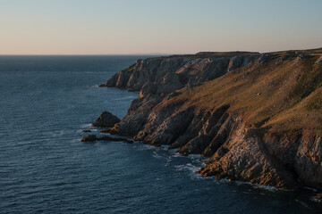 Cliff at Sunset by Ocean