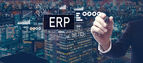 ERP - Enterprise resource planning theme with businessman in a city at night