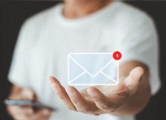 Hand showing Email concept. New email notification for business e-mail communication and digital marketing. Inbox receiving electronic message alert. Email marketing and Contact us by newsletter mail.