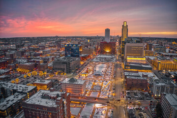 Aerial View of a Winter Sunset in Omaha, Nebraska with Holiday Lights - 574814173