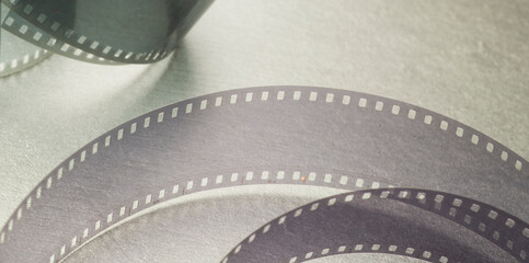 cinema background with film strip on gray background