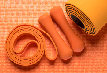 orange fitness background.orange fitness equipment on orange background for background banner