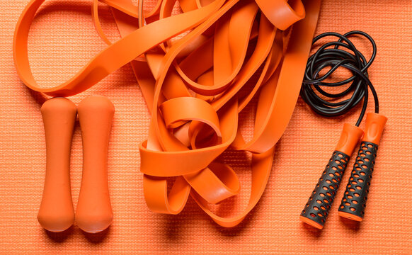 orange fitness background.orange fitness equipment on orange background for background banner