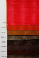 Catalog of different shades of fabric colors. Variety of color of dense fabric. Color palette