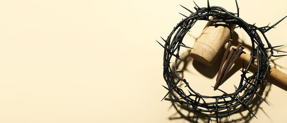 Crown of thorns, mallet and nails on light background with space for text