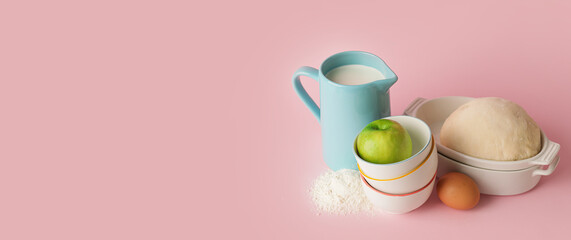 Ingredients for preparing bakery on pink background with space for text