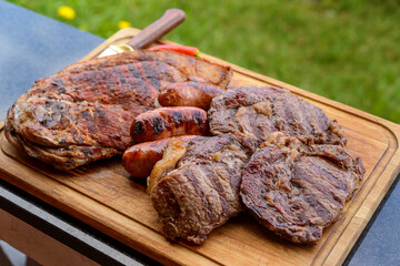 Brazilian barbecue. Roasted meats on a wooden board.