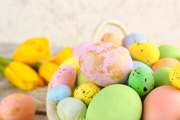Basket with beautiful Easter eggs, closeup