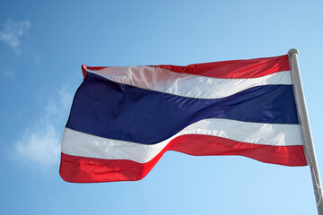 Fototapeta na wymiar Thailand flag waving in wind with blue sky