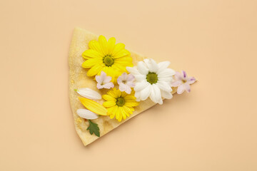 Piece of pizza with beautiful flowers on color background