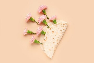 Creative composition with tortilla and carnation flowers on color background
