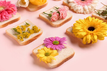 Composition with slices of bread and beautiful flowers on pink background, closeup