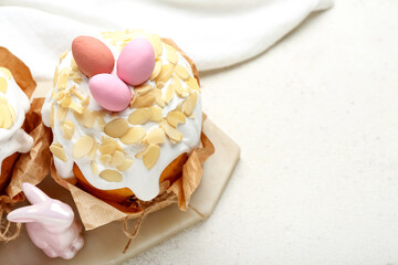 Easter cake with painted eggs and bunny on white grunge background