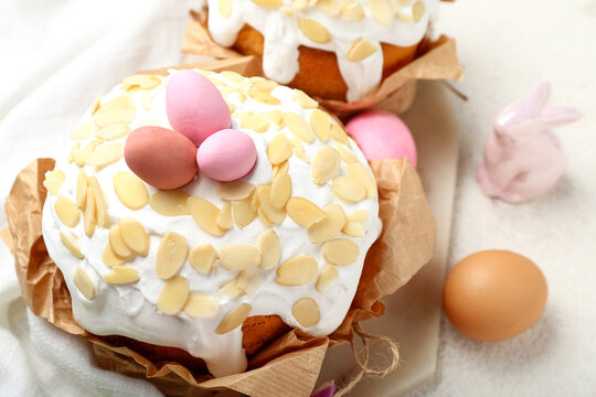 Easter cake with painted eggs on white grunge background, closeup