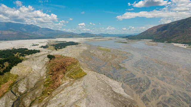 A shallow river bed in a mountain valley. Bucao river. Luzon, Philippines.