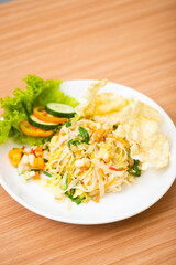 A Plate of vegetable salad served with indonesian crisps