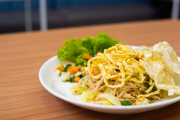 Indonesian Fried Noodles topped with shredded egg on top