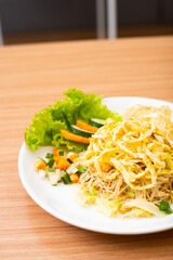 Indonesian Fried Noodles topped with shredded egg on top