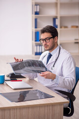 Young male doctor radiologist working in the clinic