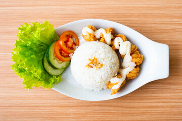 Chicken karage served with rice and topped with mayo sauce