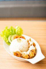 Chicken karage served with rice and topped with mayo sauce