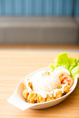 Chicken karage served with rice and topped with mayo sauce