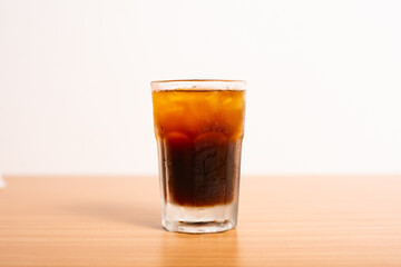 A Glass of iced americano served with ice
