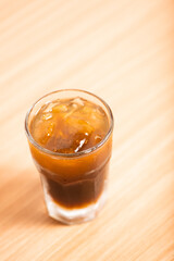 A Glass of iced americano served with ice
